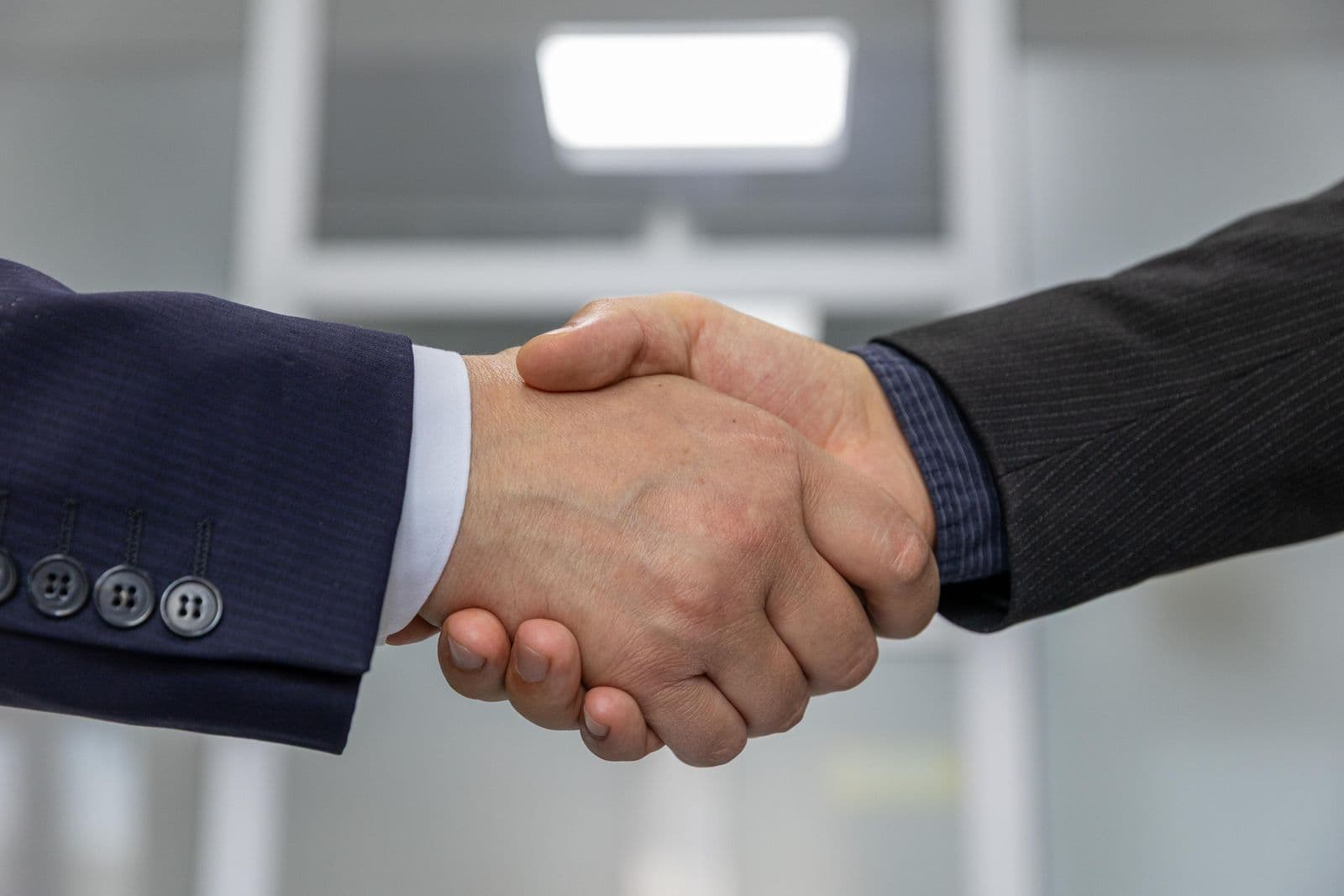 Business partnership handshake
